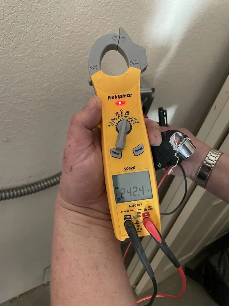Voltage testing with clamp meter during Electrical Installation Services in Bryn Mawr-Skyway